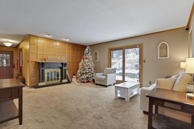 living room featuring a fireplace, ornamental molding, a textured ceiling, and light colored carpet