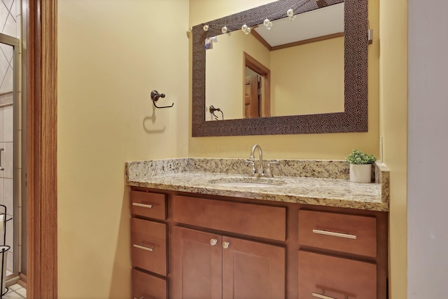 bathroom with crown molding and vanity