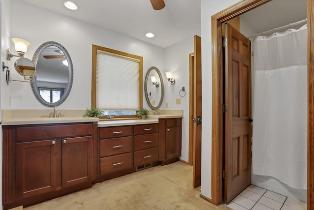 bathroom with double vanity, a sink, and recessed lighting