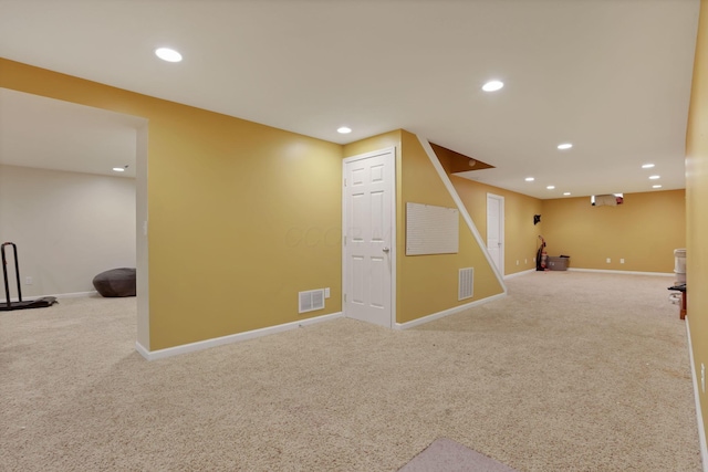 finished basement with baseboards, carpet flooring, visible vents, and recessed lighting