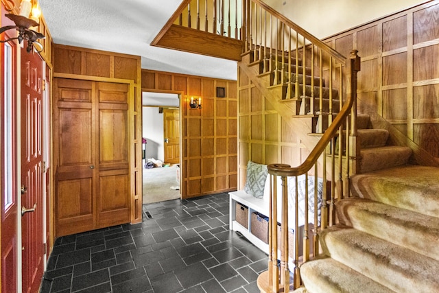 671 Carriage Ct, Newark, OH 43055 - stairway featuring wooden walls