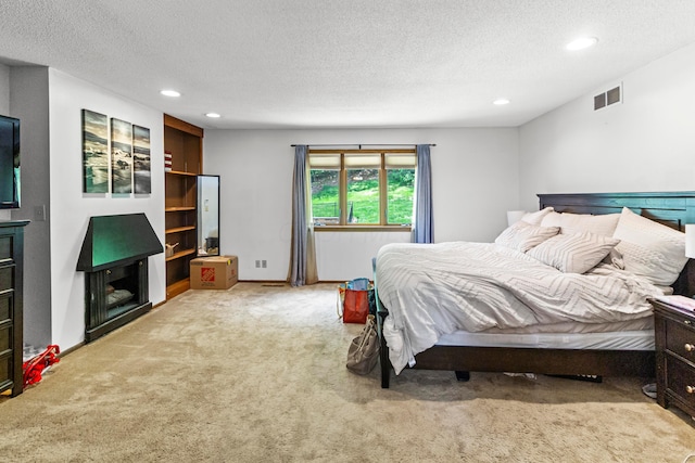 671 Carriage Ct, Newark, OH 43055 - bedroom featuring carpet, a textured ceiling, and recessed lighting