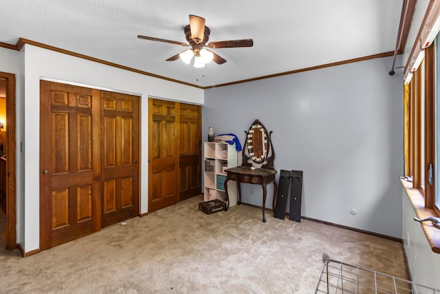 671 Carriage Ct, Newark, OH 43055 - bedroom featuring carpet flooring, two closets, ornamental molding, baseboards, and ceiling fan