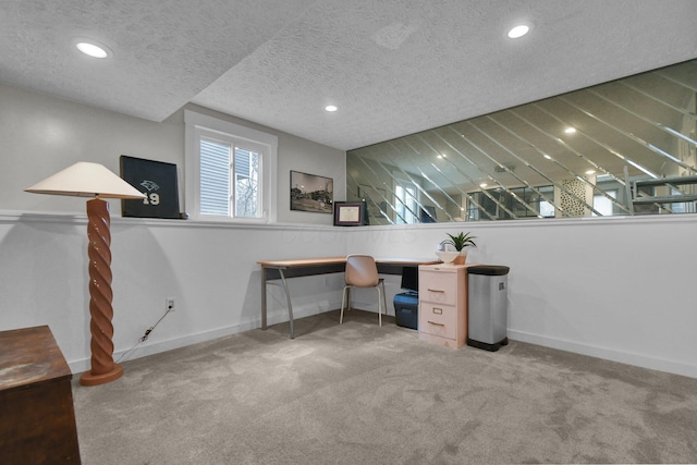 carpeted office with baseboards, a textured ceiling, and recessed lighting