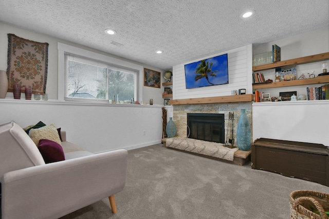 living room with visible vents, a textured ceiling, carpet flooring, a fireplace, and recessed lighting