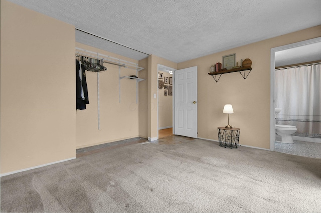 interior space featuring baseboards and a textured ceiling