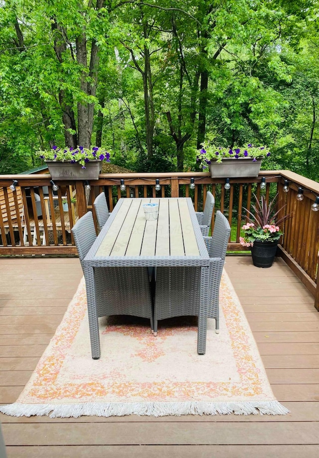 wooden deck with outdoor dining area