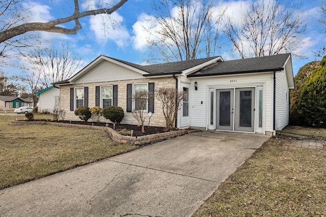 ranch-style house with brick siding, french doors, and a front lawn