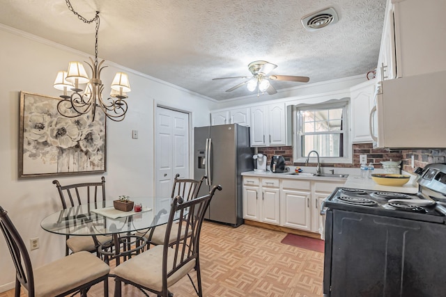 kitchen with visible vents, stainless steel refrigerator with ice dispenser, black electric range, a sink, and white cabinets