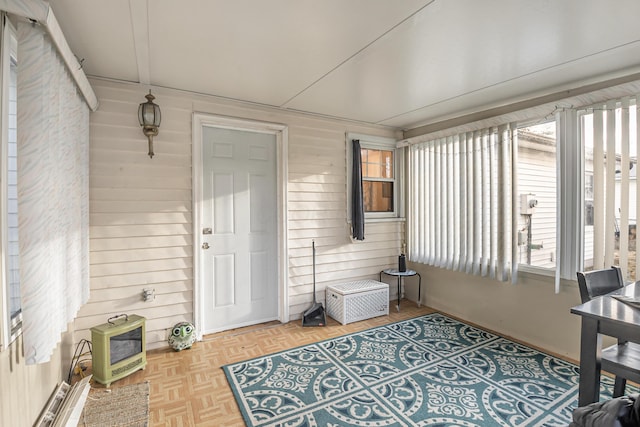 sunroom featuring heating unit