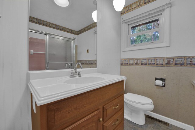 957 Sharon View Dr, Newark, OH 43055 - bathroom featuring vanity, toilet, an enclosed shower, and tile patterned floors