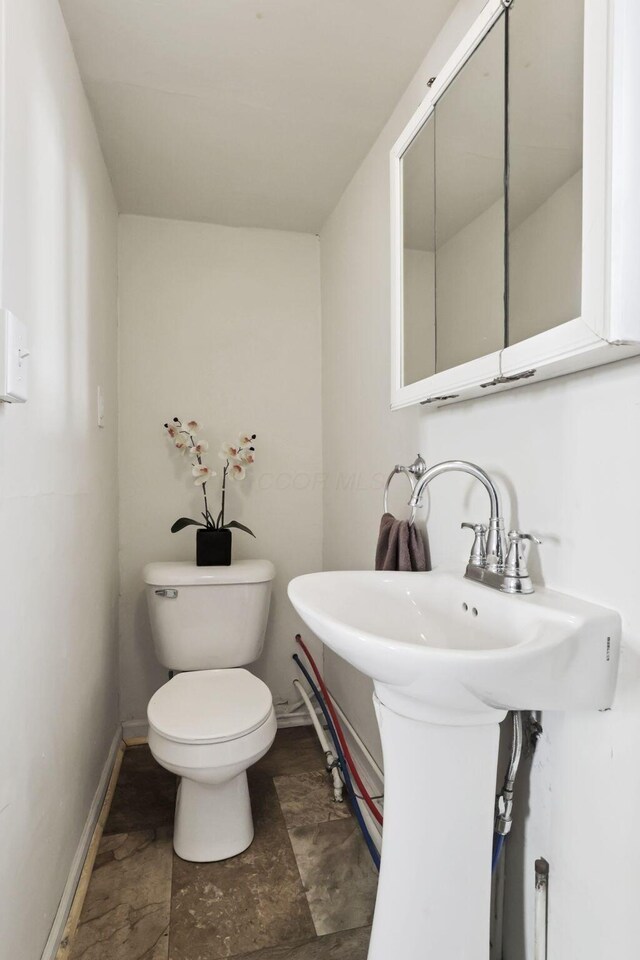 71 3rd St, Lancaster, OH 43130 - bathroom with toilet and stone finish floors