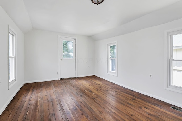 71 3rd St, Lancaster, OH 43130 - empty room featuring vaulted ceiling, dark wood finished floors, and plenty of natural light