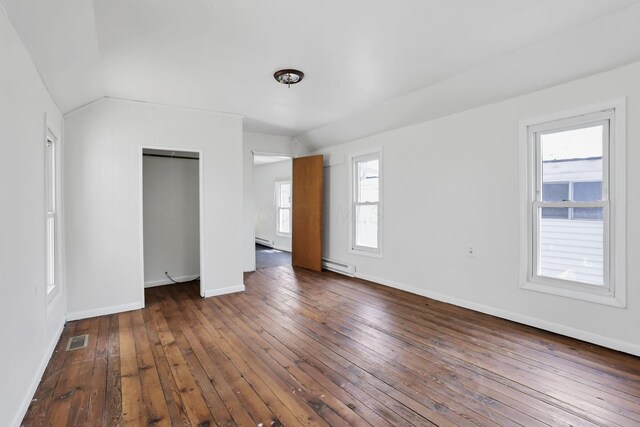 71 3rd St, Lancaster, OH 43130 - unfurnished bedroom with a baseboard heating unit, hardwood / wood-style floors, a closet, and lofted ceiling