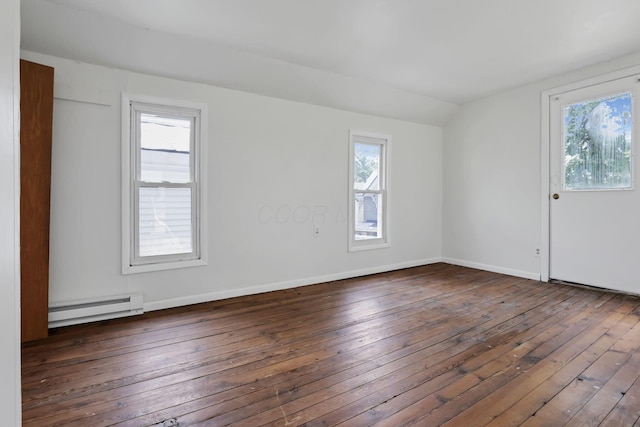 71 3rd St, Lancaster, OH 43130 - spare room featuring baseboard heating, vaulted ceiling, and wood-type flooring