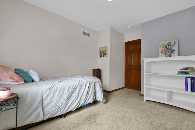 bedroom featuring visible vents, baseboards, and carpet flooring