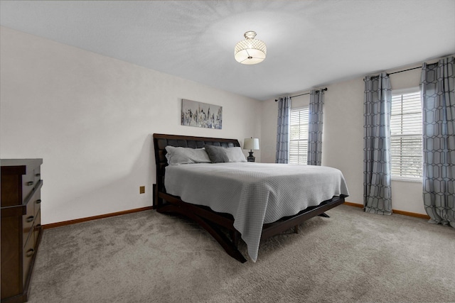 carpeted bedroom with baseboards