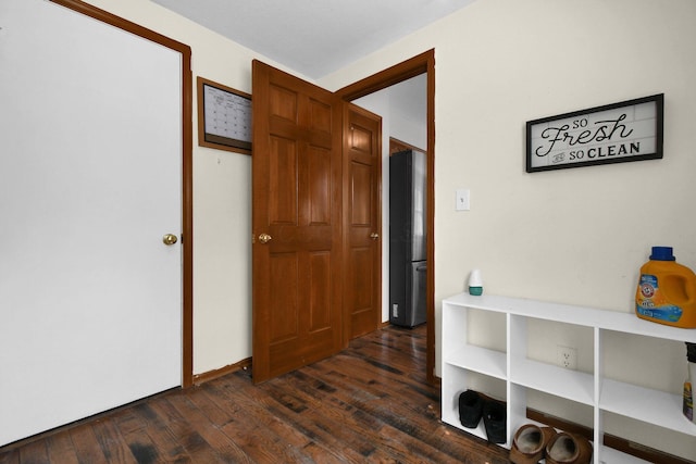 hallway featuring dark wood-style flooring