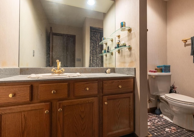 full bath featuring toilet, a shower, and vanity