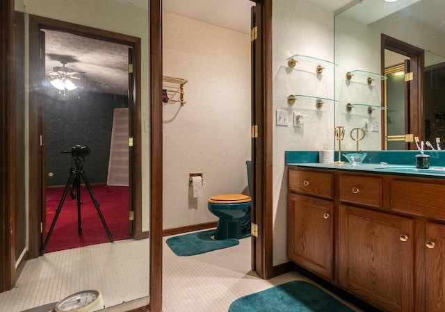 bathroom with toilet and vanity