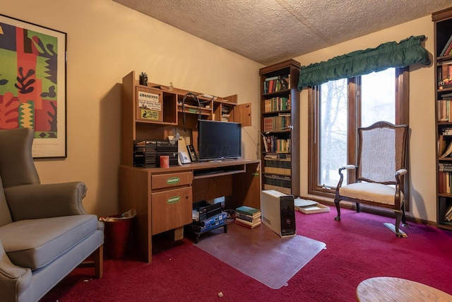 home office with dark carpet and a textured ceiling