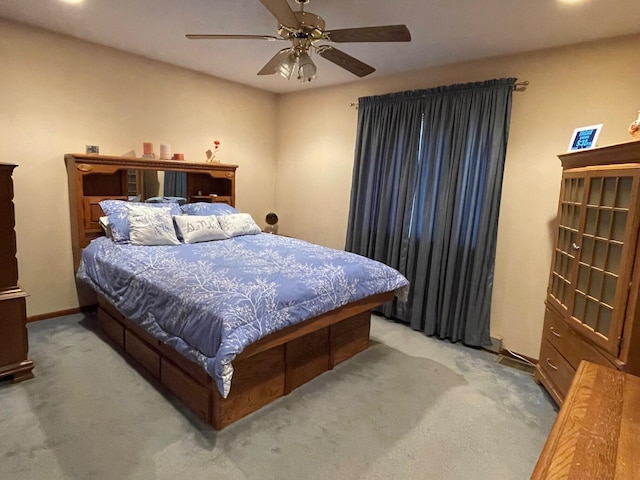 bedroom featuring ceiling fan, baseboards, and carpet flooring