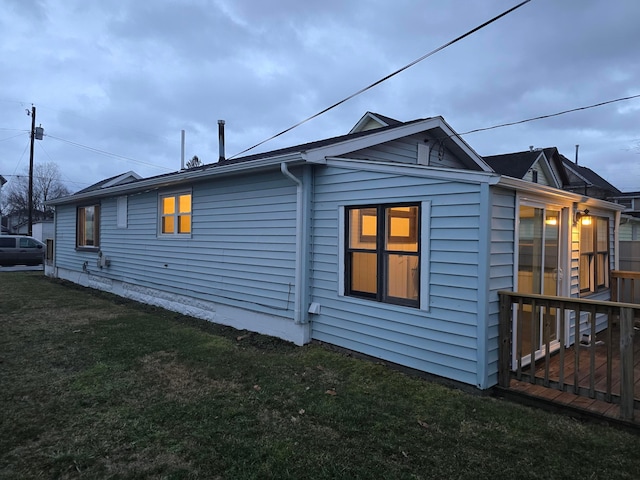 view of side of home featuring a yard