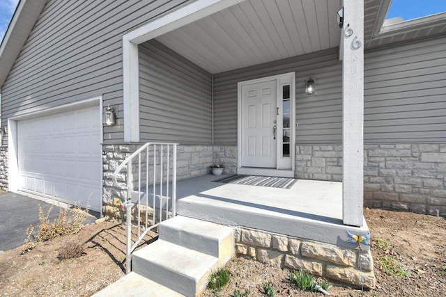 property entrance featuring a porch and stone siding