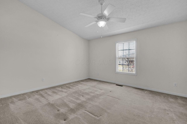 unfurnished room with baseboards, carpet floors, a textured ceiling, and ceiling fan