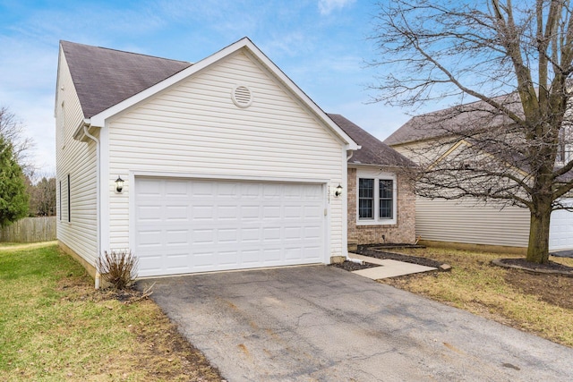 single story home with a garage, brick siding, a shingled roof, and aphalt driveway