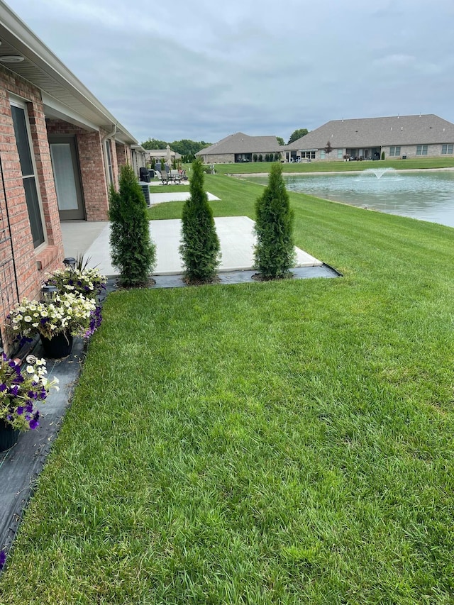 view of yard with a water view