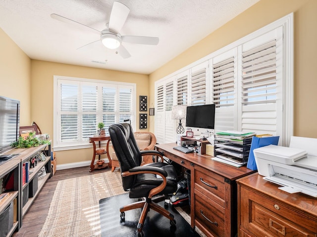 office area featuring baseboards, a textured ceiling, a ceiling fan, and wood finished floors