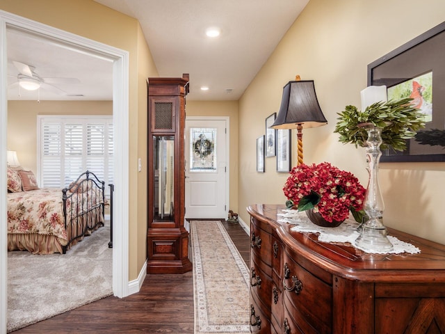 interior space with dark wood-style floors, a healthy amount of sunlight, and baseboards