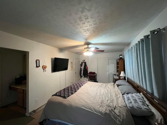 bedroom featuring a ceiling fan, baseboards, and a textured ceiling