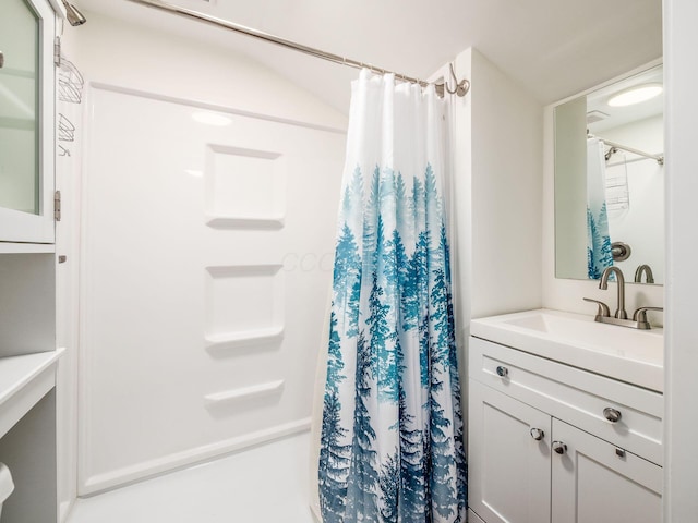 full bath with curtained shower and vanity