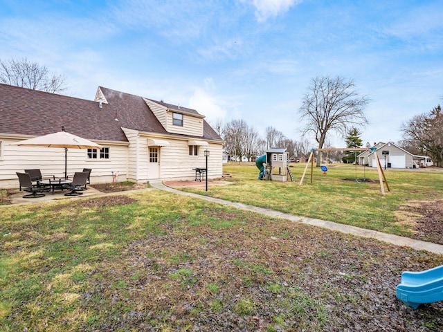 view of yard with a playground and a patio