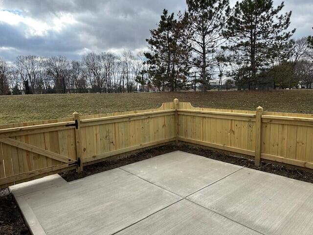 view of patio / terrace featuring fence