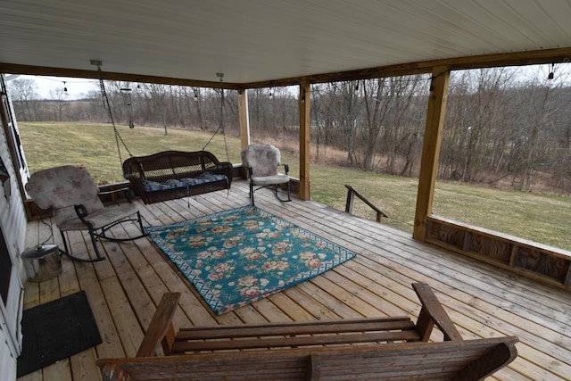 wooden terrace featuring a yard and outdoor dining area