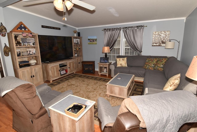 living room featuring a ceiling fan, light wood-type flooring, crown molding, and lofted ceiling