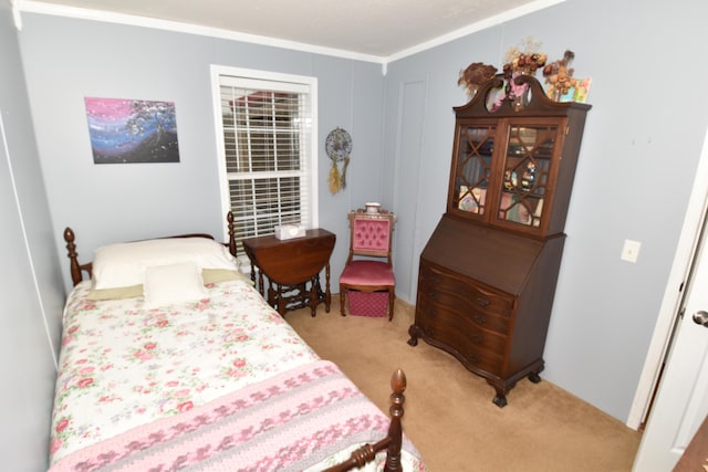 bedroom featuring crown molding and light colored carpet