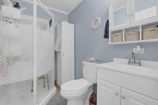 full bath featuring toilet, a stall shower, vanity, and crown molding