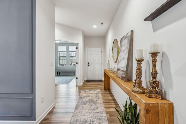 interior space with visible vents, recessed lighting, baseboards, and wood finished floors