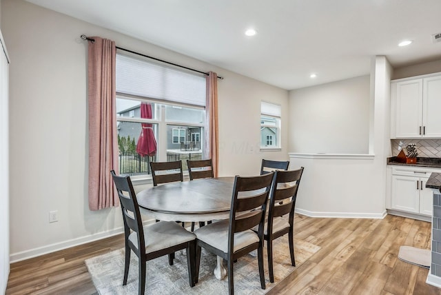 dining space with visible vents, recessed lighting, baseboards, and light wood-style floors