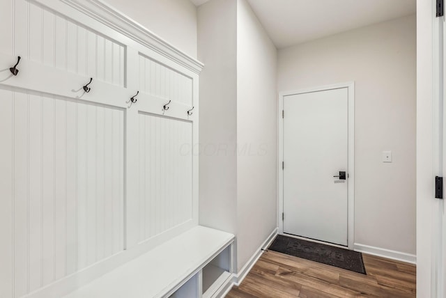 mudroom with baseboards and wood finished floors