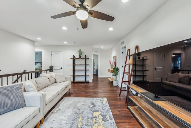 living area featuring recessed lighting, wood finished floors, visible vents, and baseboards