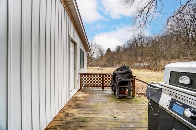 wooden terrace featuring grilling area