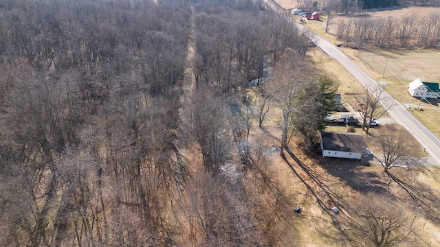 aerial view featuring a rural view and a view of trees