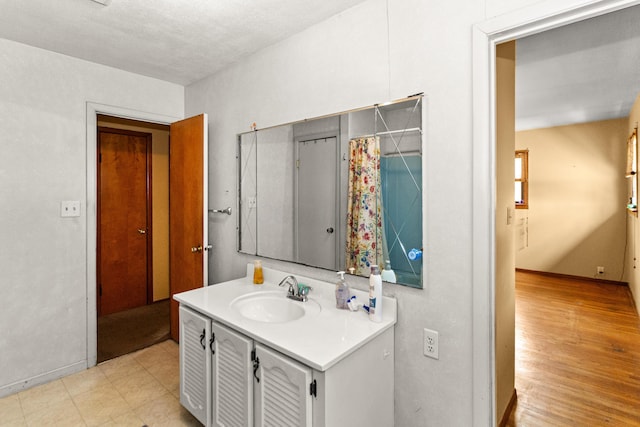 bathroom with vanity and wood finished floors