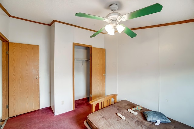 unfurnished bedroom featuring carpet floors, ceiling fan, and crown molding