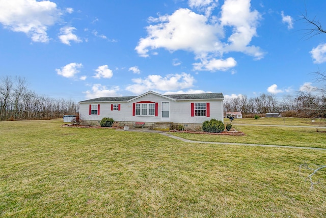 manufactured / mobile home featuring crawl space and a front yard